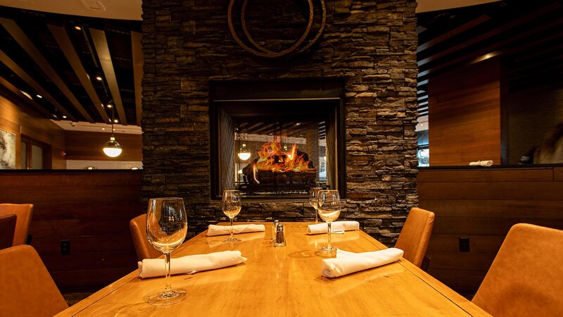 Dining room table with view of fireplace